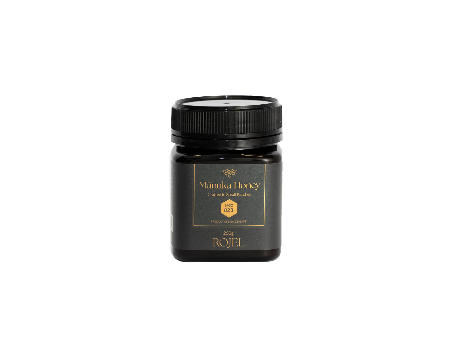 Jar of Manuka Honey with a black lid on a white background